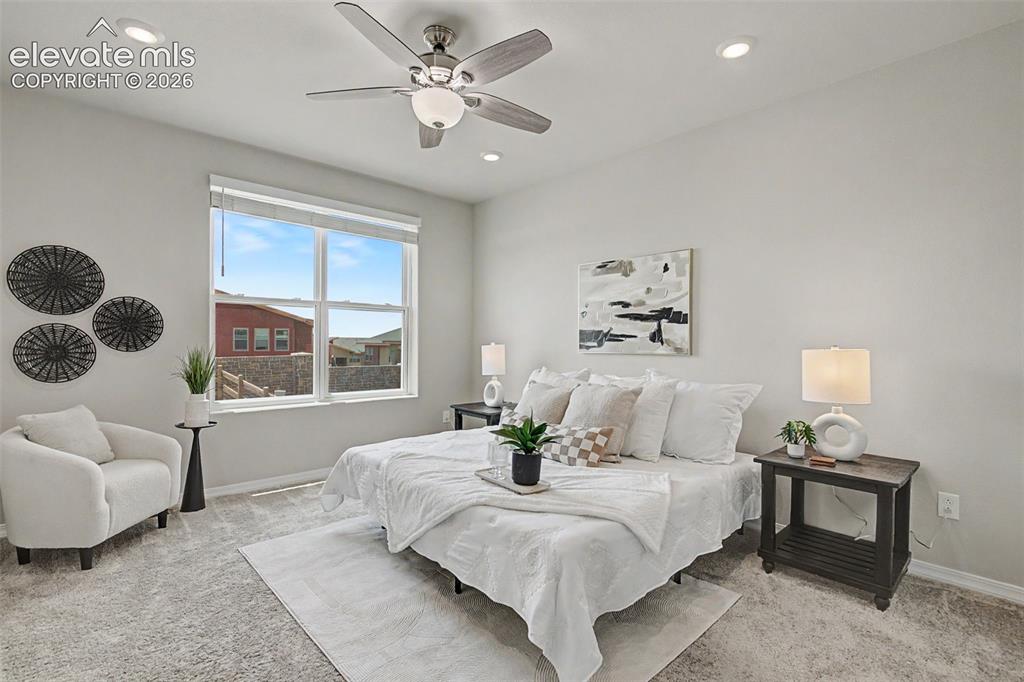 Image 22 of 45: Spacious room featuring light-colored walls and carpet flooring