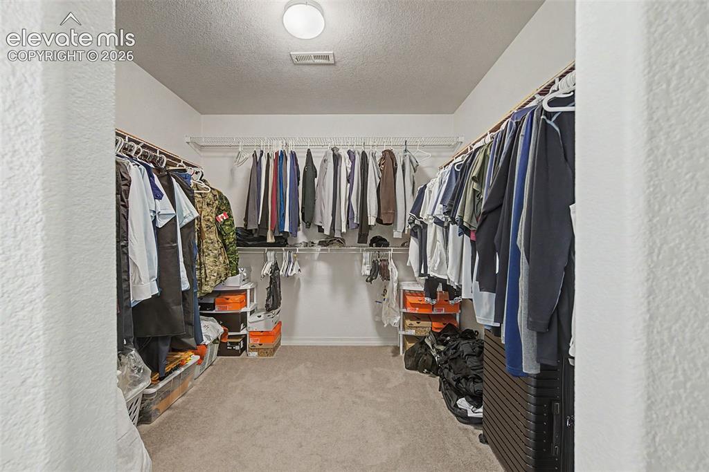 Image 29 of 38: Big Primary walk in Closet