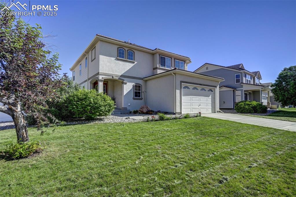 Image 10 of 50: Mediterranean / spanish home with stucco siding, driveway, an attached gara