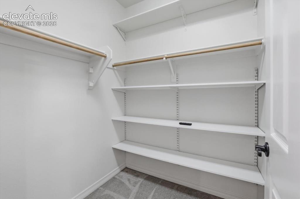 Image 32 of 47: Generous walk-in closet for secondary bedroom