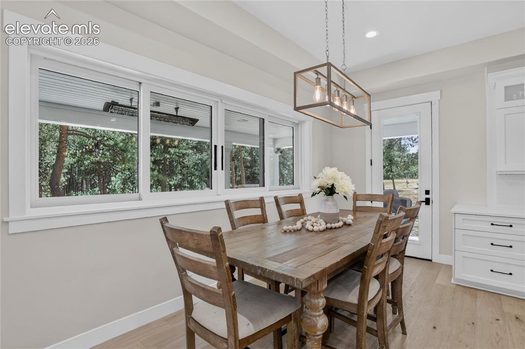Image 12 of 47: Hand-through window from kitchen to patio