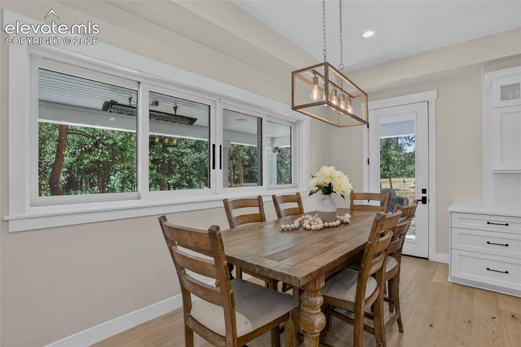 Image 12 of 47: Hand-through window from kitchen to patio