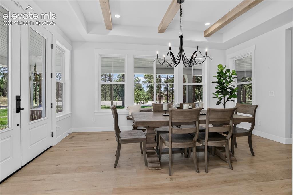 Image 13 of 47: Formal dining room w/ walk-out