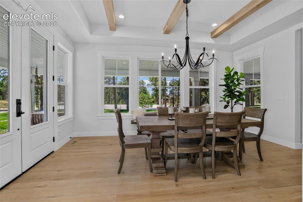 Image 13 of 47: Formal dining room w/ walk-out