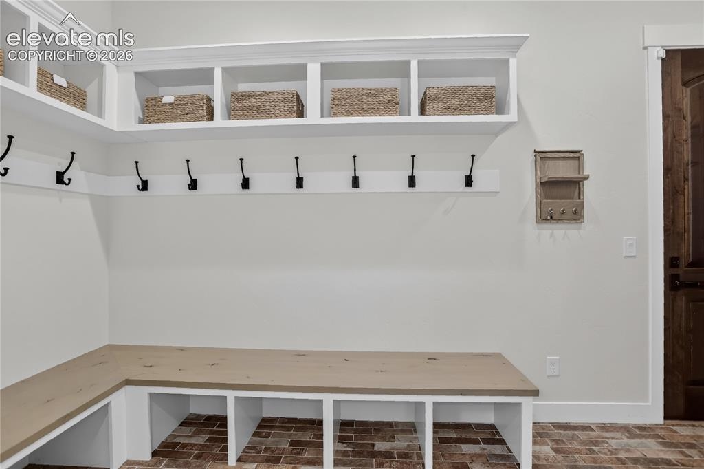 Image 20 of 47: Mudroom w/ coat closet & storage