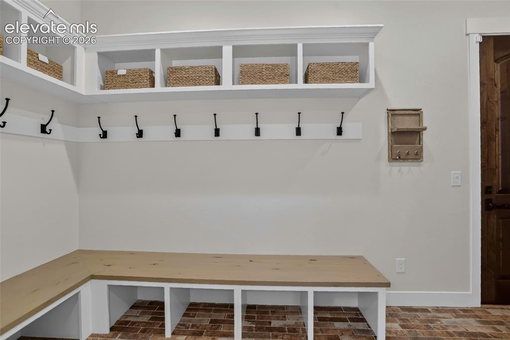 Image 20 of 47: Mudroom w/ coat closet & storage