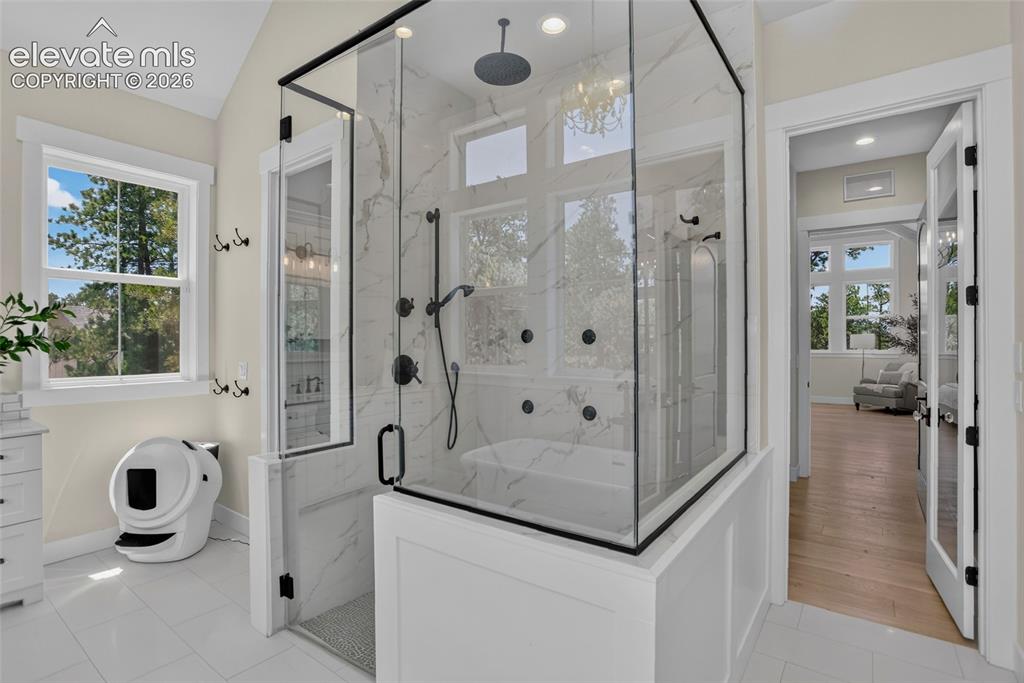 Image 24 of 47: Zero-threshold shower w/ multiple shower heads