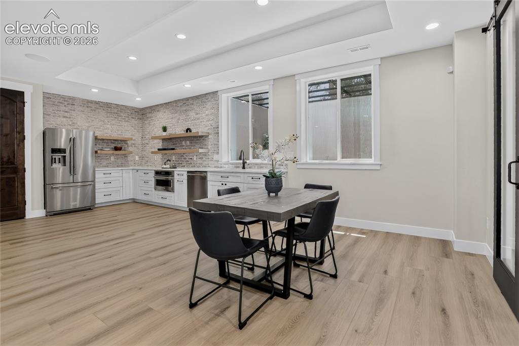 Image 32 of 47: Secondary kitchen w/ dining area