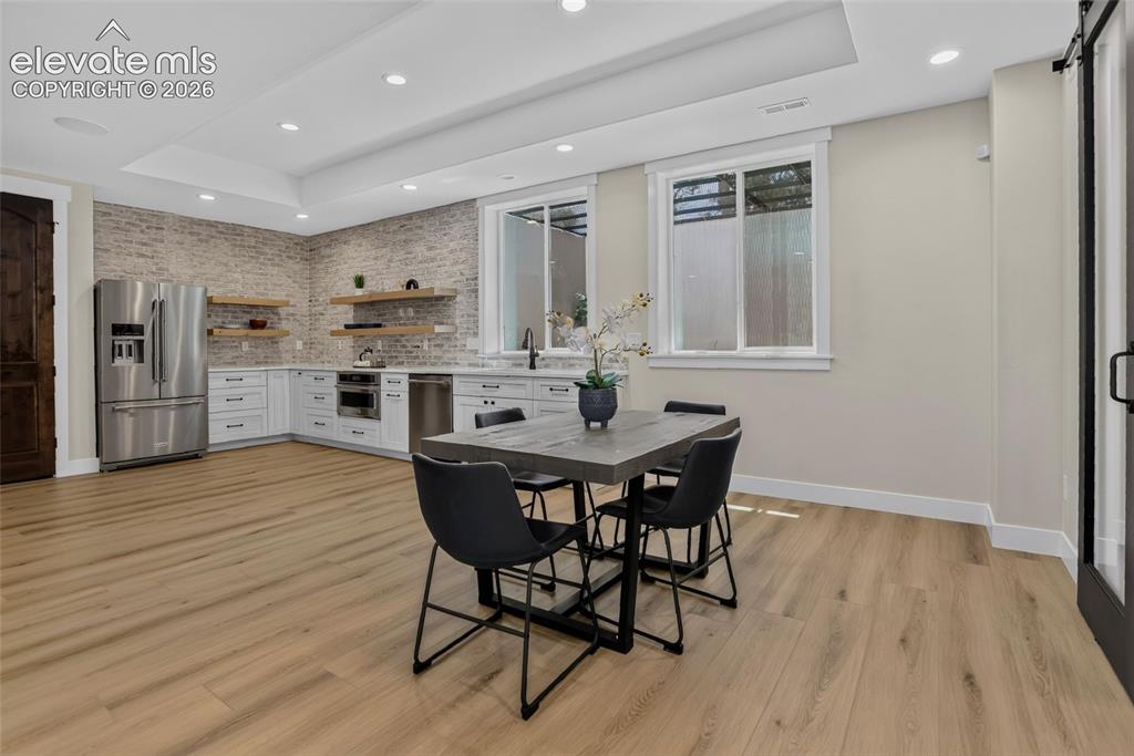 Image 32 of 47: Secondary kitchen w/ dining area