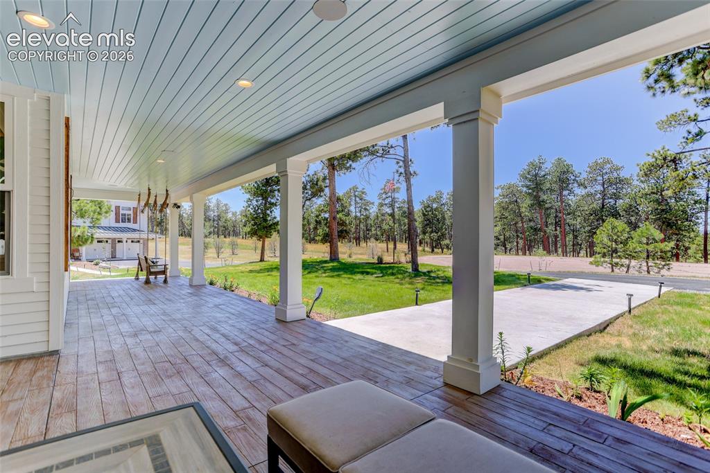 Image 4 of 47: Tongue and groove covered porch