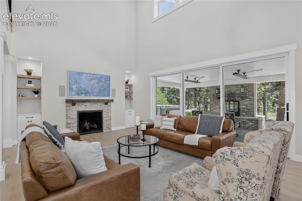 Image 8 of 47: Living room w/ telescopic patio doors