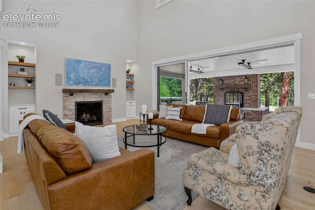 Image 8 of 47: Living room w/ telescopic patio doors