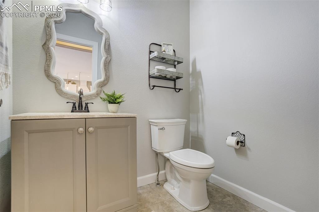 Image 20 of 50: Half bathroom on the main level. 