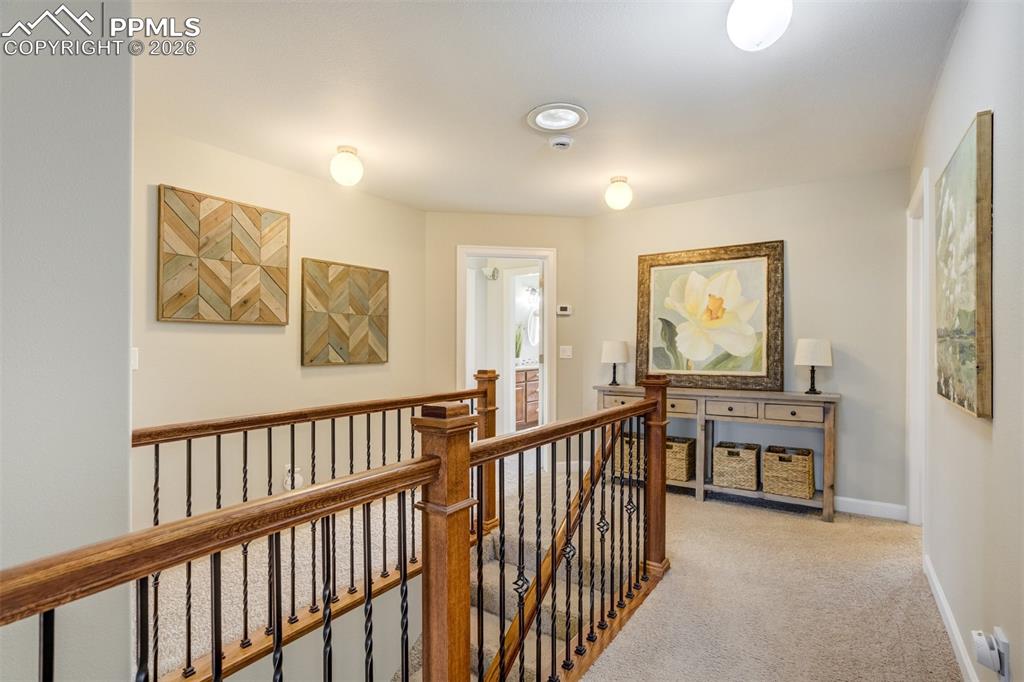 Image 22 of 50: Upstairs landing area is open with 4 bedrooms on the same level.