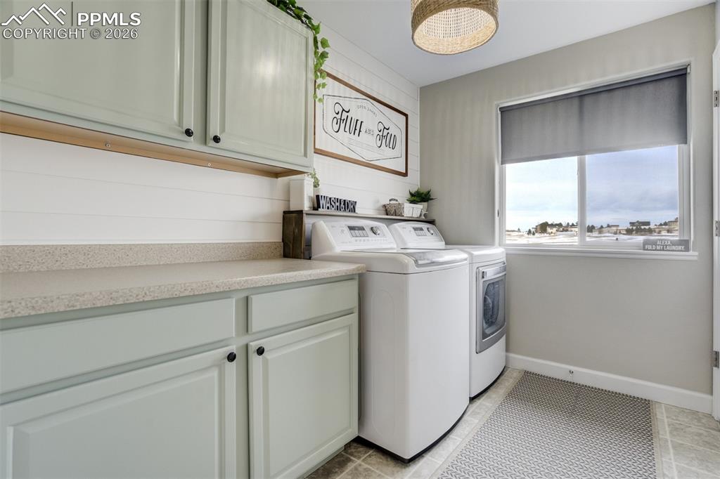 Image 36 of 50: Laundry room upstairs (also with a view) and storage. 