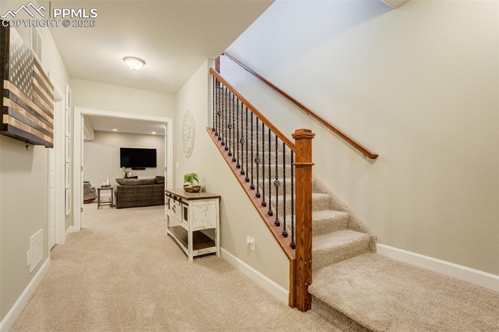 Image 37 of 50: Finished basement- French doors lead to the family room & Junior Suite. 