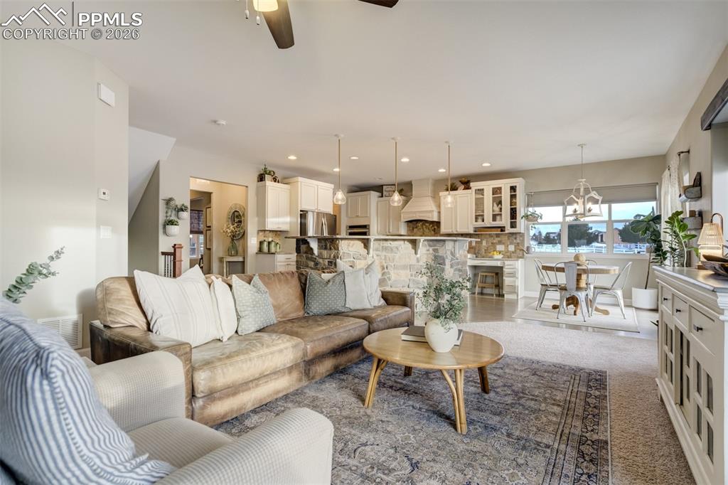 Image 4 of 50: Main level flows between the living room, kitchen, and dining area. 