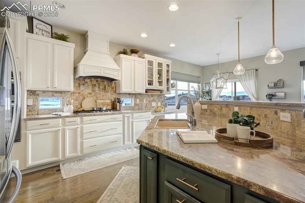 Image 6 of 50: Refinished kitchen cabinets. 