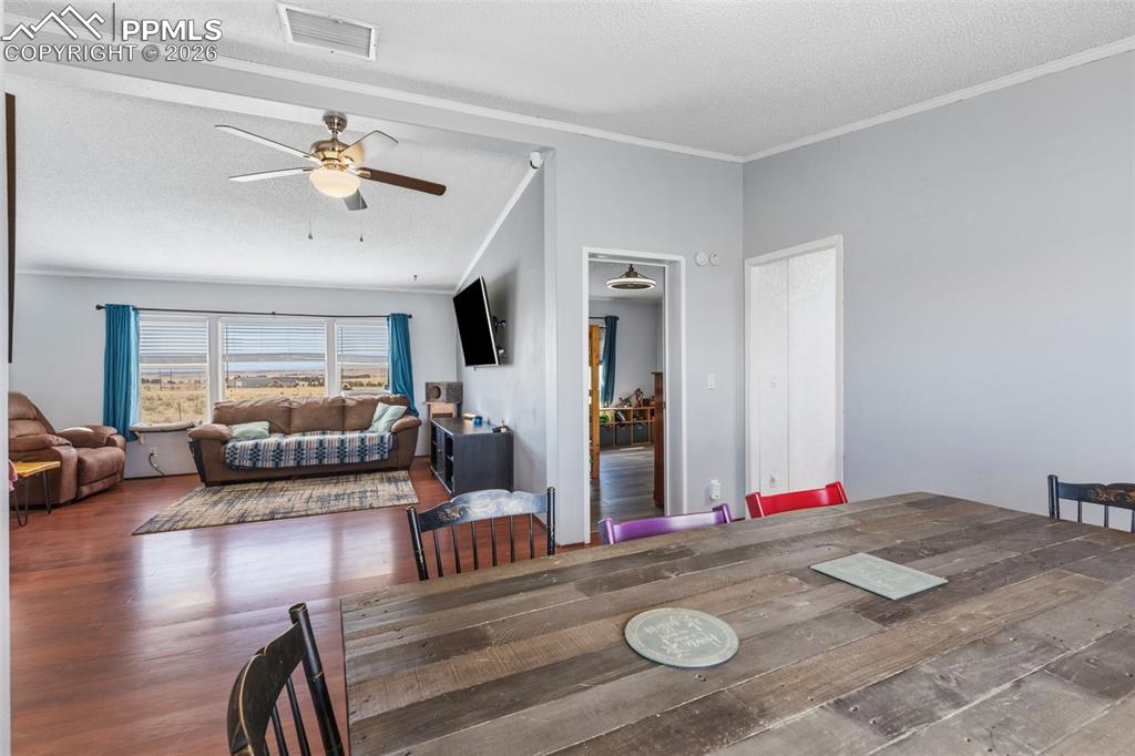 Image 11 of 34: Dining Area Looking into Living Room