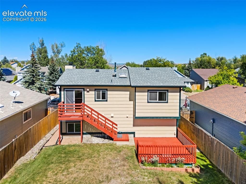 Image 37 of 40: Exterior features include a multi-level deck, lower-level patio access, pri