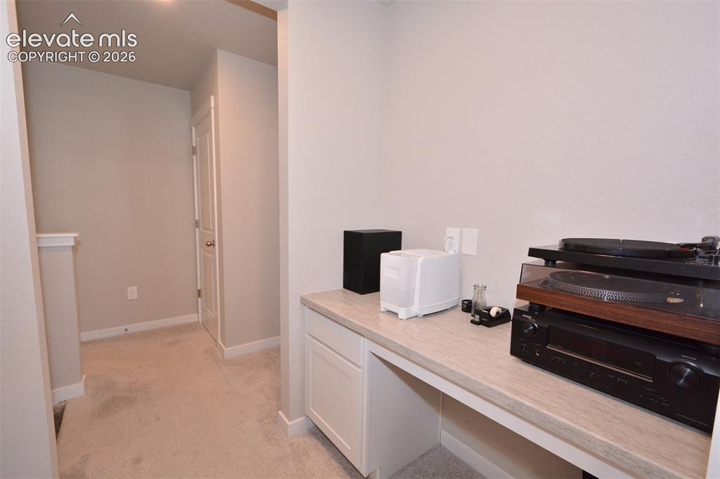 Image 16 of 27: Hallway into the Primary Bedroom on upper level