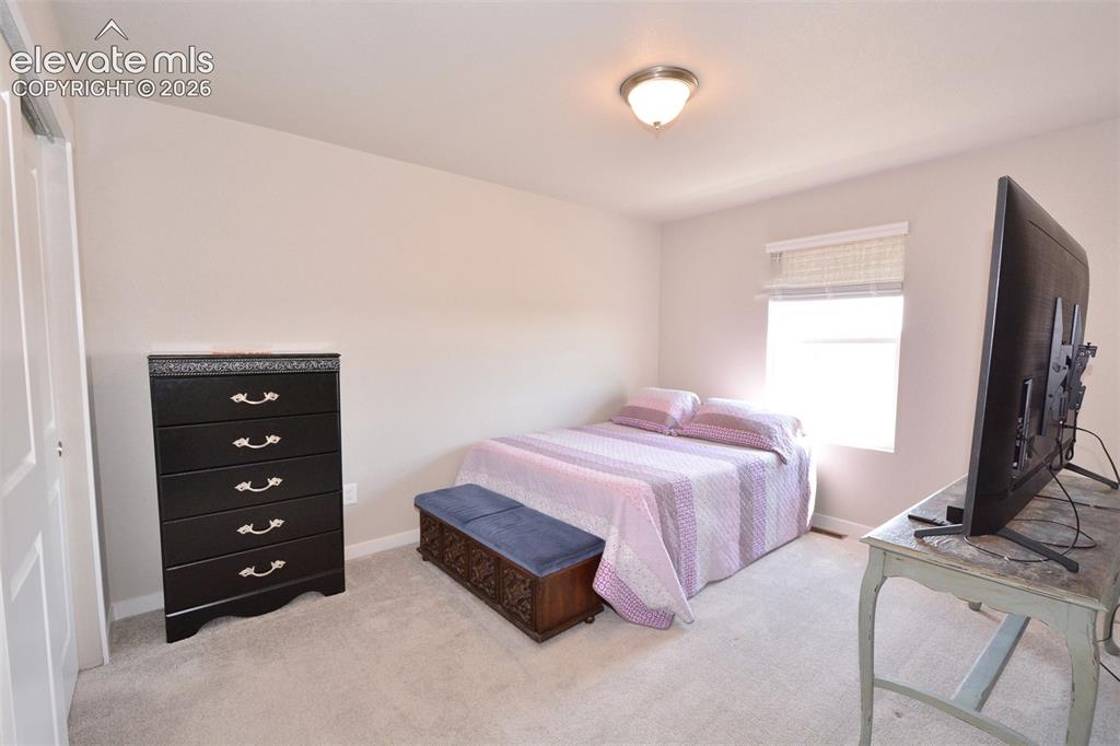 Image 18 of 27: Bedroom on upper level
