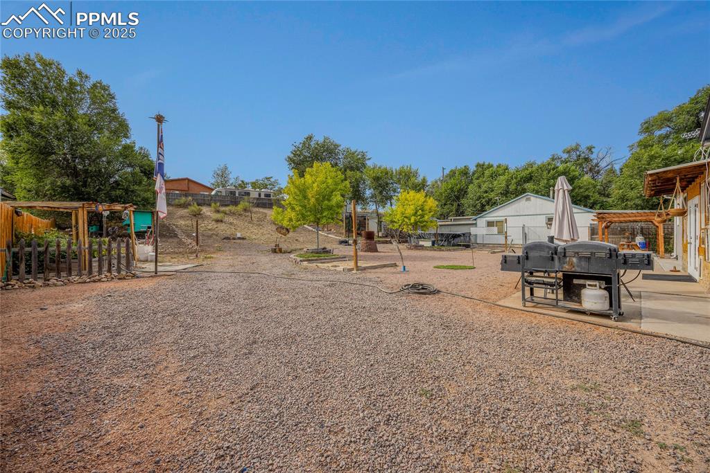 Image 28 of 31: View of yard with a patio and a pergola