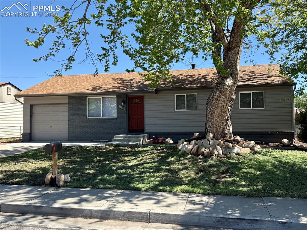 Image 1 of 27: Ranch-style exterior with gray siding and dark gray brick accents