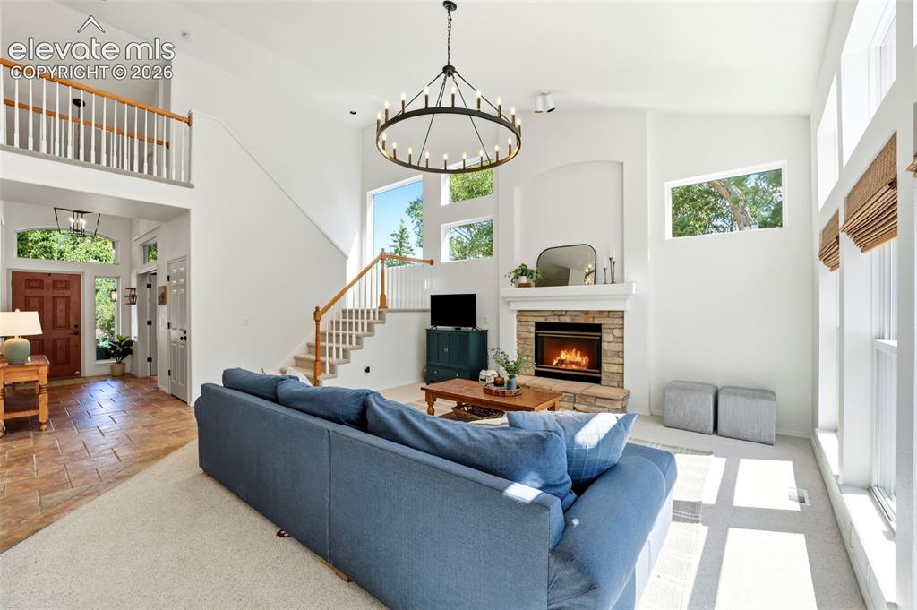 Image 11 of 50: Living room looking in to the entry