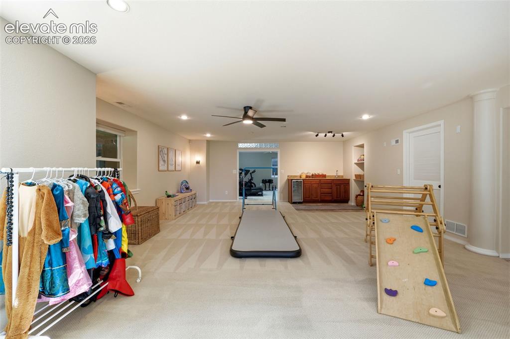 Image 26 of 50: Basement with wet bar and plenty of space