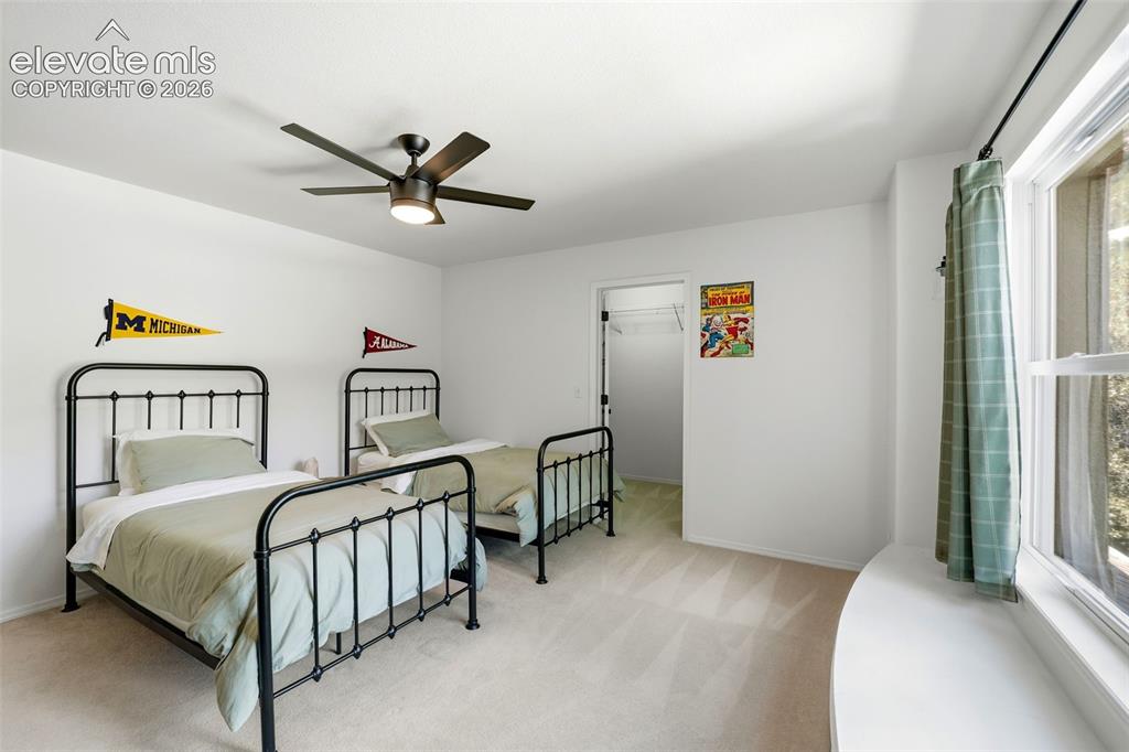 Image 34 of 50: Secondary upstairs bedroom with adorable window seat