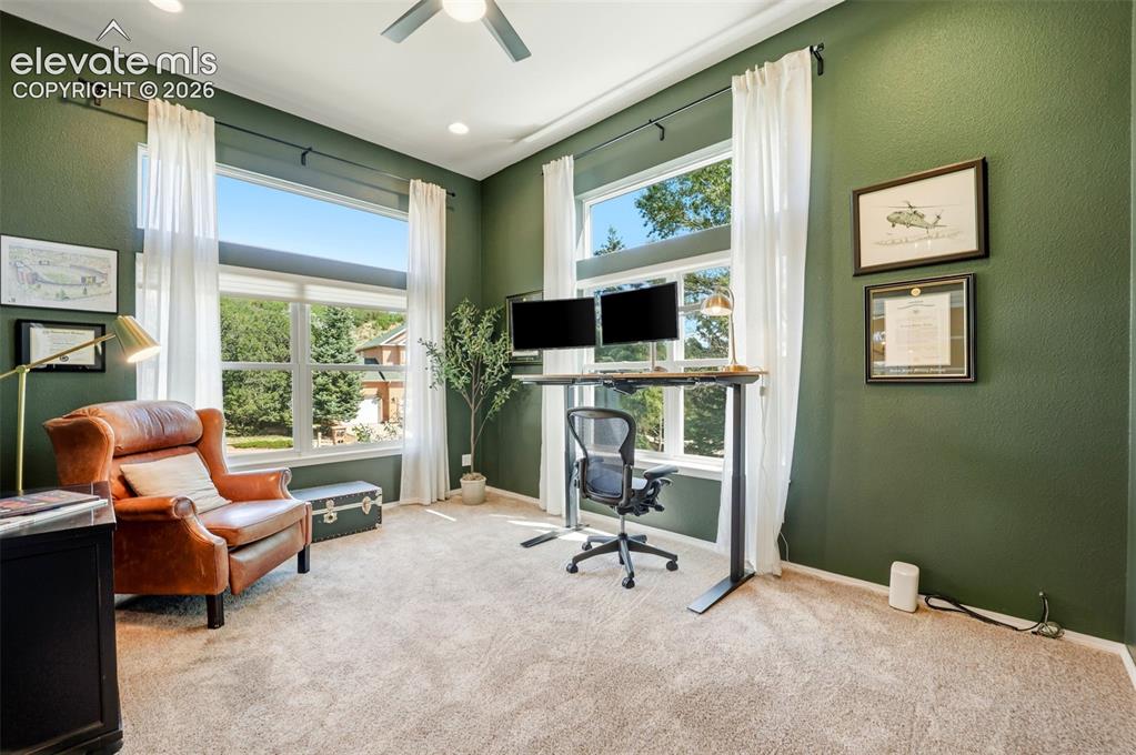 Image 7 of 50: Office at the front of the home featuring high ceilings