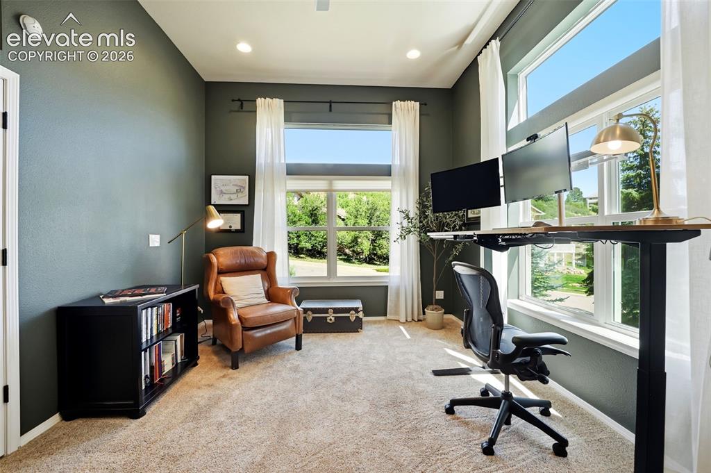 Image 8 of 50: Carpeted room with recessed lighting and high ceilings