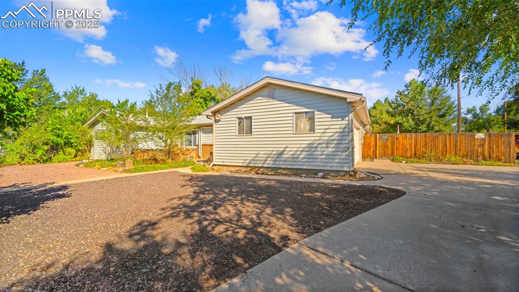 Image 2 of 33: View of front of house with driveway