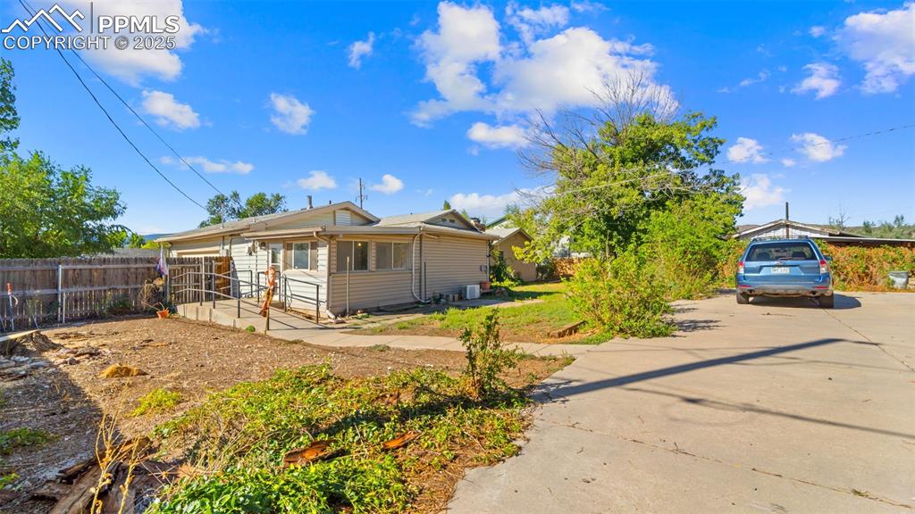 Image 26 of 33: View of front of property with driveway