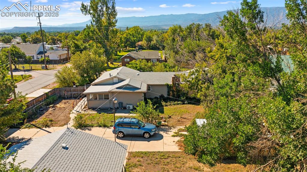 Image 28 of 33: View from above of property with mountains