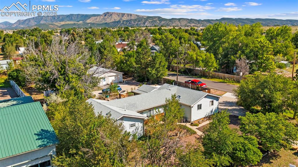 Image 31 of 33: View of subject property with a mountainous background