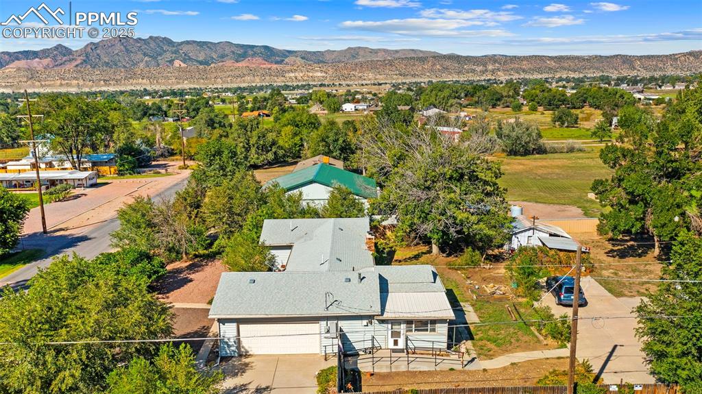 Image 32 of 33: View of subject property with a mountainous background