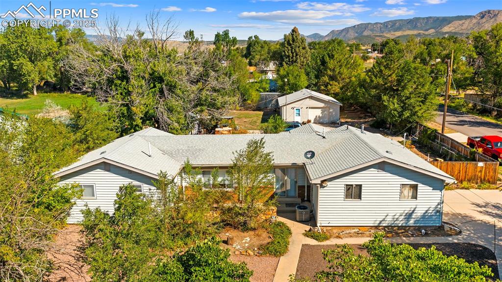 Image 33 of 33: View of subject property with a mountainous background
