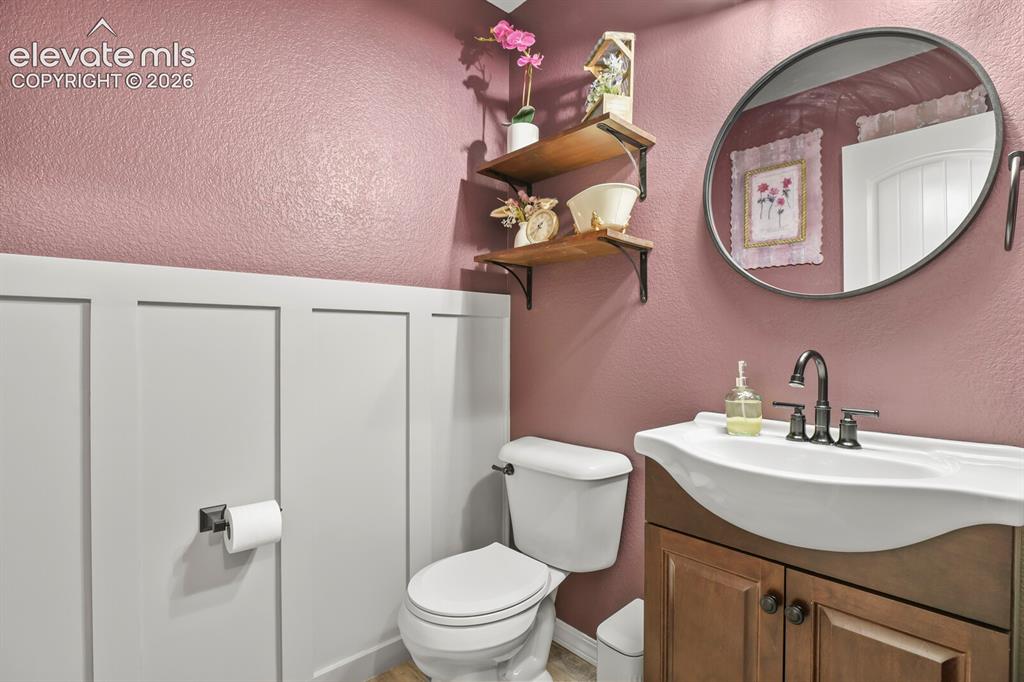 Image 17 of 38: Main floor half bath