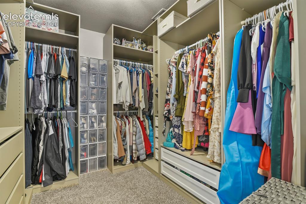 Image 25 of 38: Customized primary closet