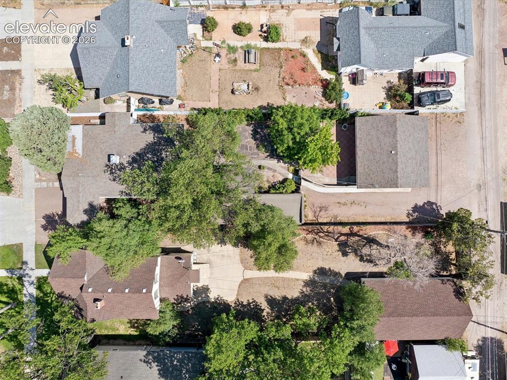 Image 31 of 35: Overhead perspective showcasing a residential property with a shingle roof