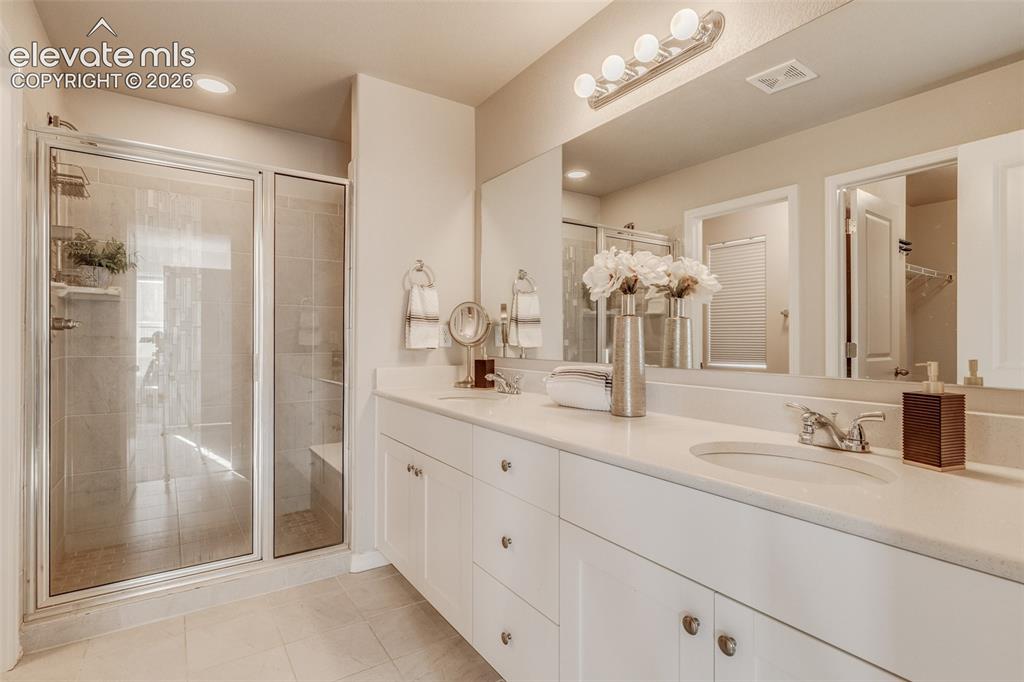 Image 20 of 39: Primary bathroom with large walk-in shower