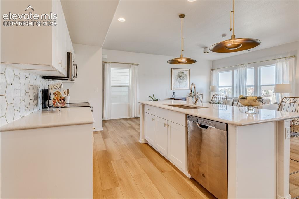 Image 4 of 39: Nice large planked LVP throughout the lower level