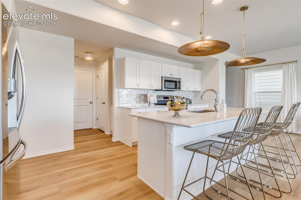 Image 5 of 39: Kitchen has great lighting, countertops and cabinets