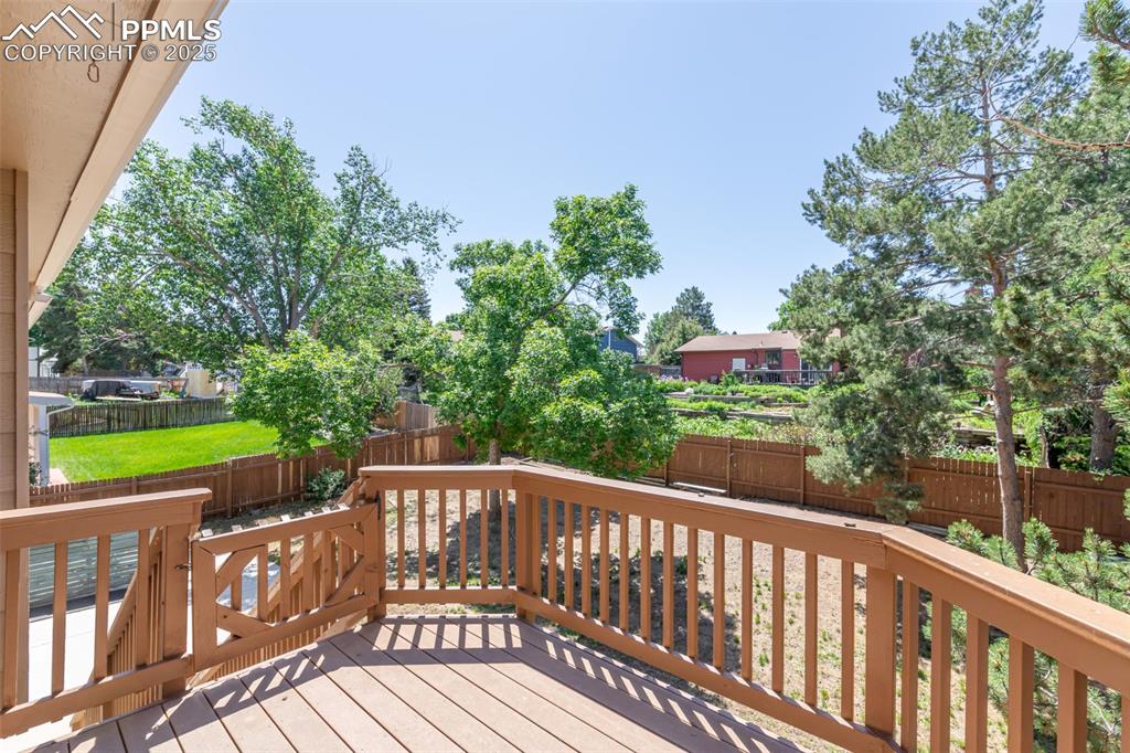 Image 16 of 38: Deck with a fenced backyard