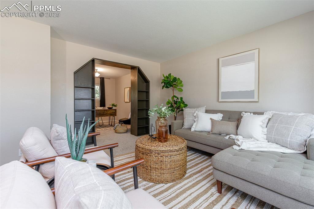 Image 6 of 38: View of carpeted living area
