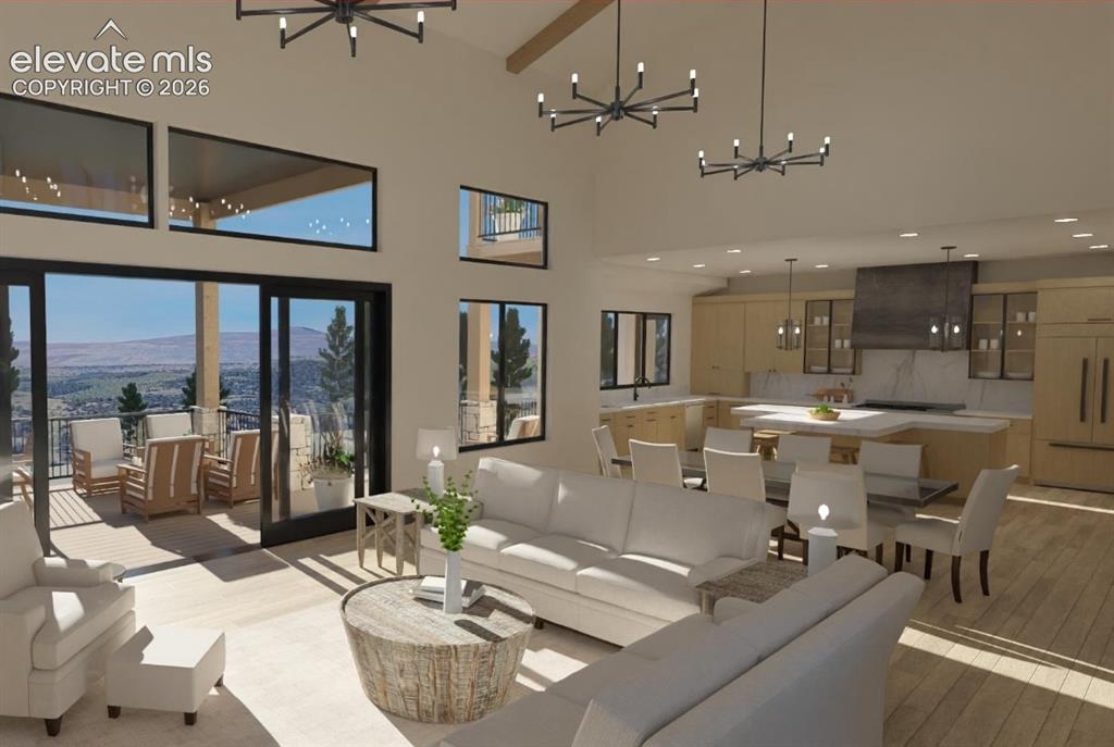 Image 12 of 32: Vaulted ceilings featuring exposed beams and modern chandeliers, a kitchen 