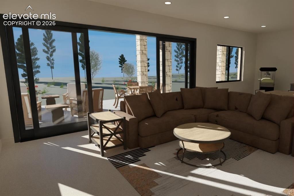 Image 19 of 32: Recessed ceiling lighting, large format sliding glass doors, white walls, a