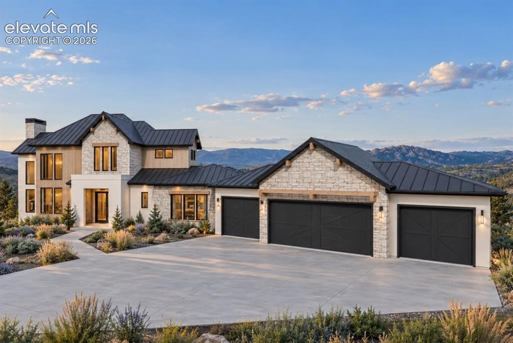 Image 6 of 32: Hill Country Contemporary architectural design with a metal roof, stone an
